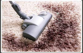 hovering and steam cleaning a stain from a carpet